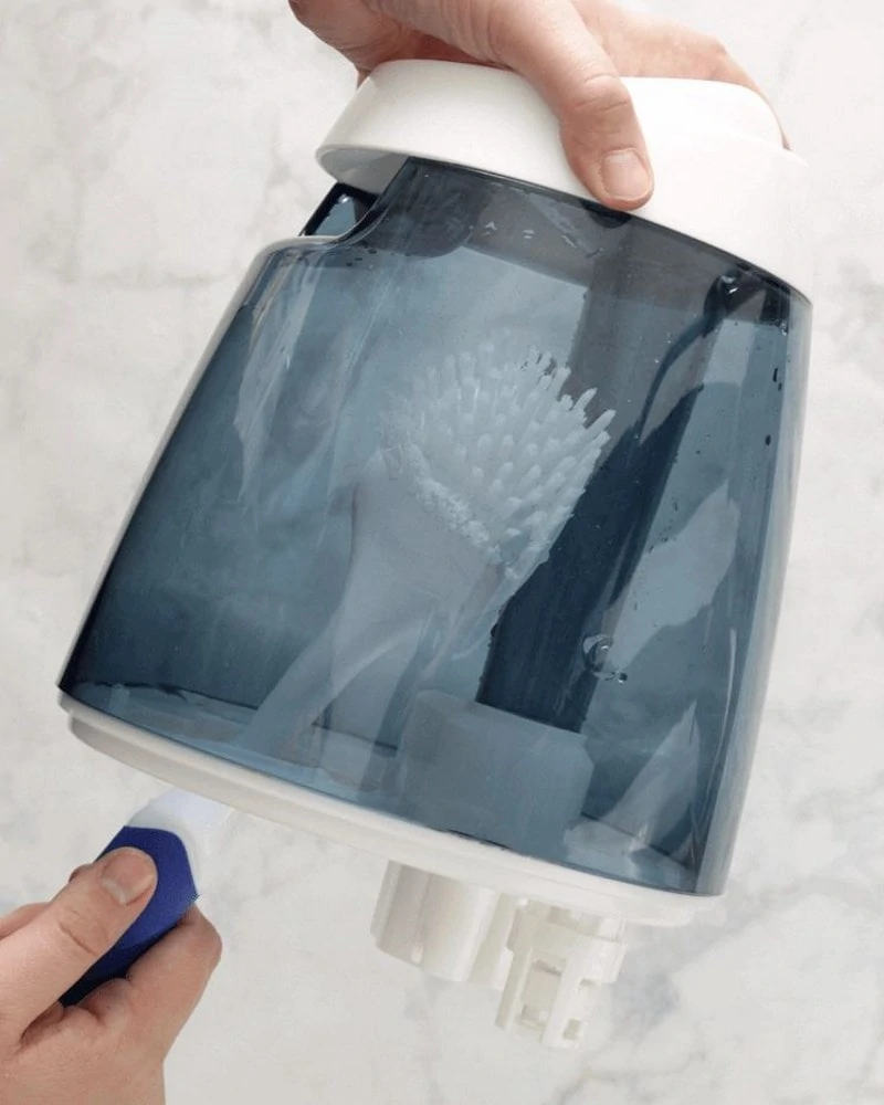 Image of a humidifier being cleaned by hand