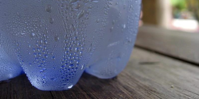 Bottle of water with condensation in humidity example image