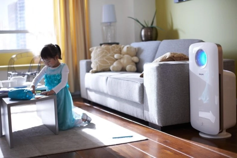 Image of child in living room with air purifier